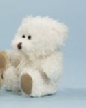 Cuddly sitting bear made of crum...